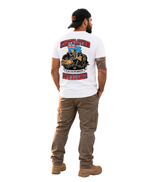 A man is shown from behind wearing a white graphic t-shirt, brown cargo pants, and a black baseball cap. The t-shirt features a large back graphic with the words 'EARTHQUAKE' and 'DOWNTUNDER' in red, along with a detailed illustration of a truck and a blue helmet.