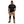 Man wearing a black t-shirt and beige work pants with black accents on a white background