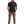Man wearing a black t-shirt with a logo, brown pants, and boots on a white background