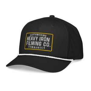Black Heavy Iron embroidered SnapBack, left-front view showing the curved peak and white rope.