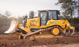 CAT D6XE electric-drive bulldozer moving earth on a worksite, photographed by Earthmoving Downunder