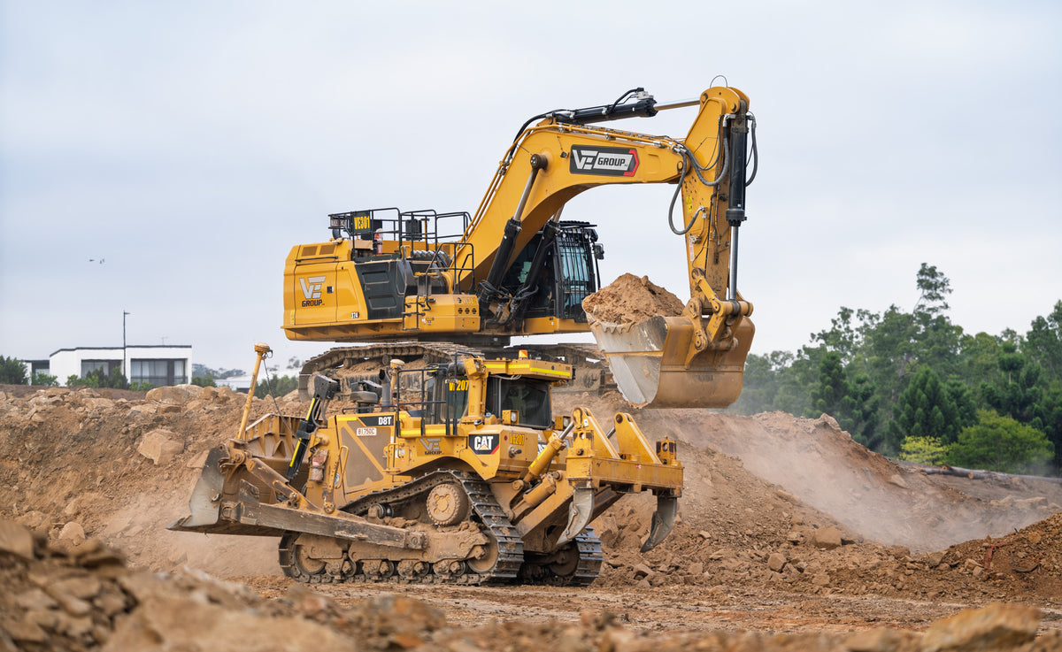 Large excavator and CAT D8T bulldozer working on an earthmoving site, photographed by Earthmoving Downunder
