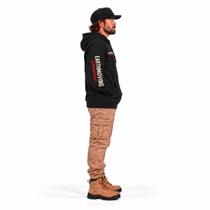 Earthmoving Downunder Wedge-tailed Eagle Premium Hoodie in black — full-length left sleeve model mockup with hands in pocket, lettering reads shoulder to cuff