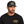 Close-up of the black Heritage T-shirt styled with the Heavy Iron Filming Co. SnapBack. SnapBack sold separately.
