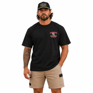 Black We Built the Land Downunder Staple Tee, front model view with Heavy Iron SnapBack. Hat sold separately.