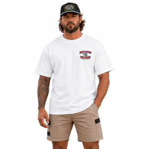 White We Built the Land Downunder Staple Tee, front model view with Heavy Iron SnapBack. Hat sold separately.
